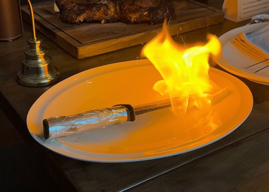 Tomahawk contemporary steakhouse steak fired up