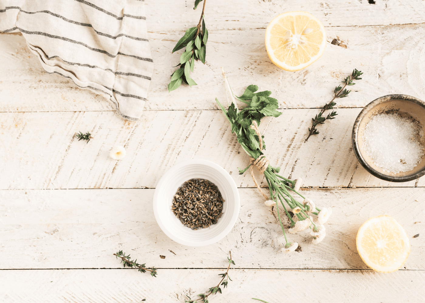 bowls of leaves and herbs on table