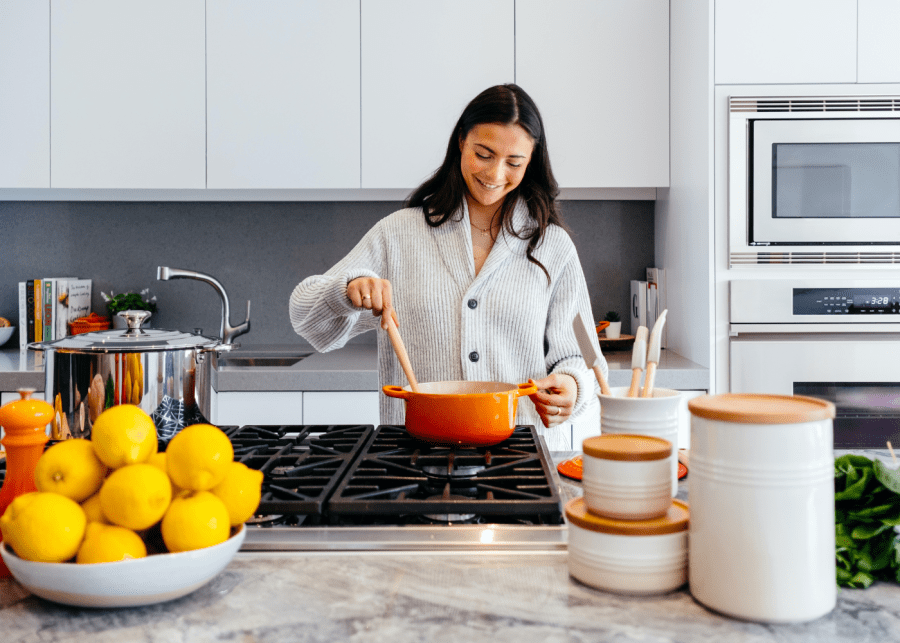 food waste in singapore | woman cooking in kitchen