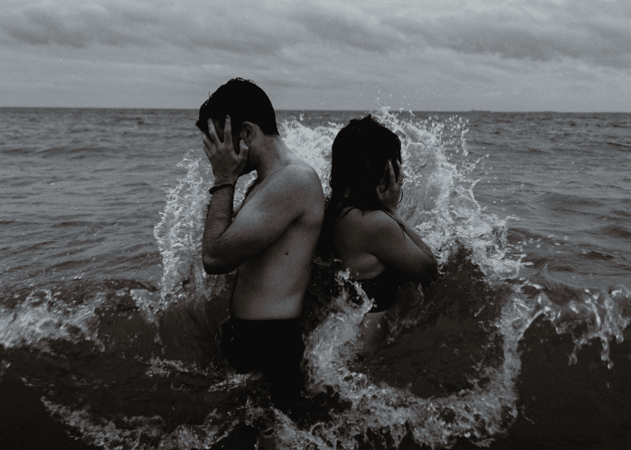 relationship red flags | couple in the ocean