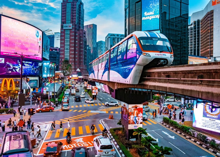 What to do in KL - Busy road in Kuala Lumpur with Rapid KL train