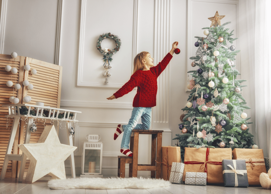 sustainable christmas | child decorating tree