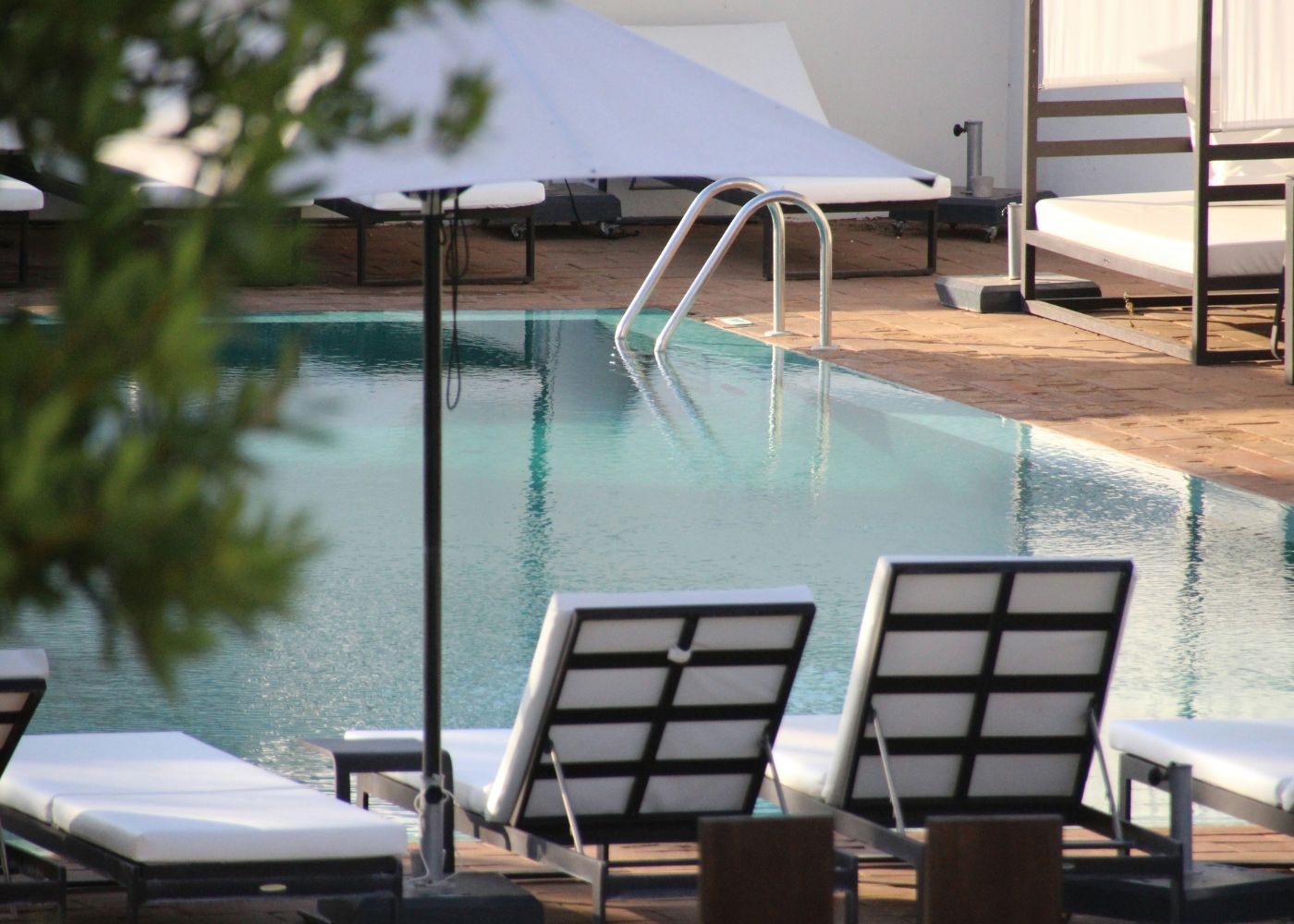 Best boutique hotels in Singapore - outdoor swimming pool with sun loungers