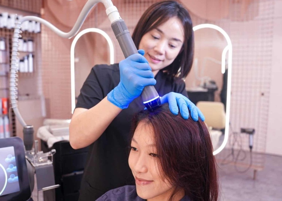 Best-hair-loss-treatments-in-Singapore-TrichoLab-staff-conducting-treatment-on-customers-scalp