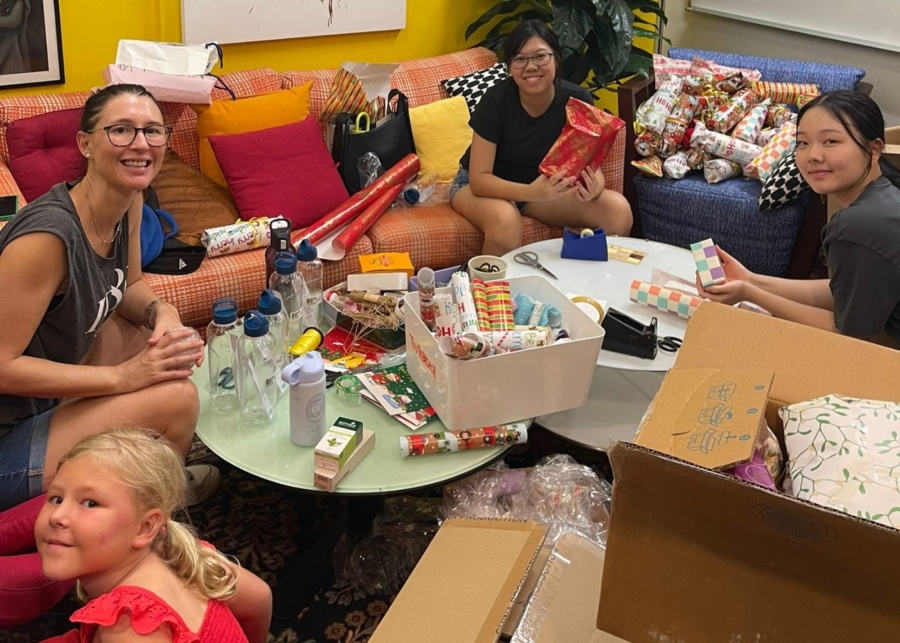 It's Raining Raincoats gift wrapping | Volunteer in Singapore for Christmas