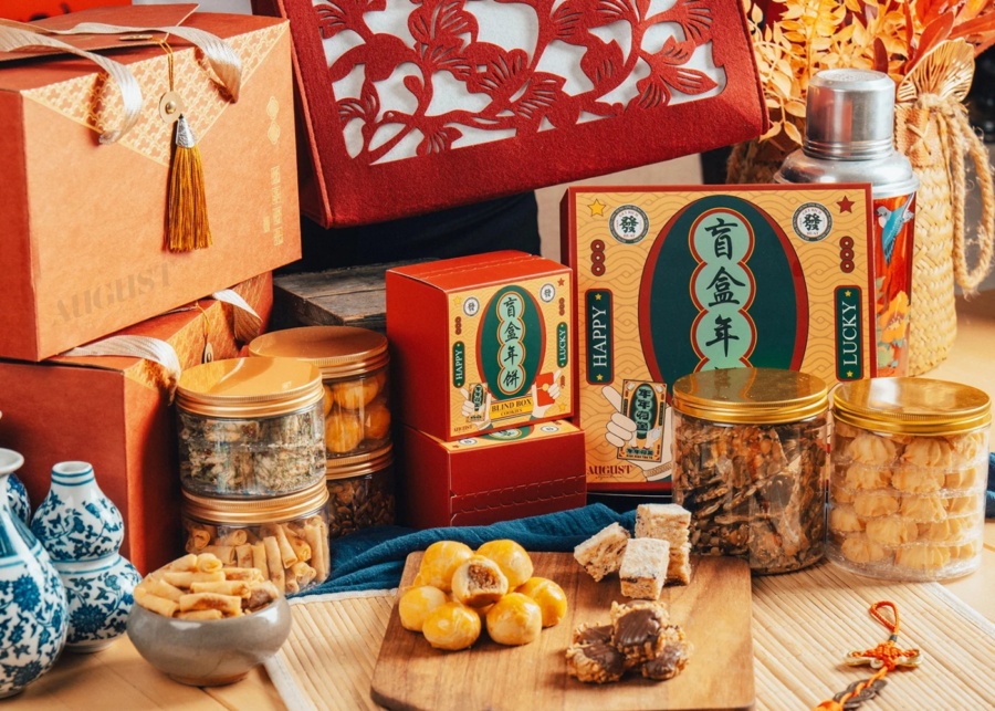 Best CNY 2026 snacks in Singapore - August Signature hero image with a festive spread of tarts, cookies and blind boxes