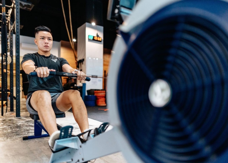 Best gyms in Singapore - Level - A man on the rowing machine