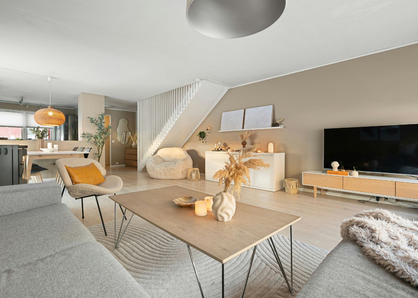 Best furniture stores in Singapore - Brightly lit living area with furniture and flat-screen tv