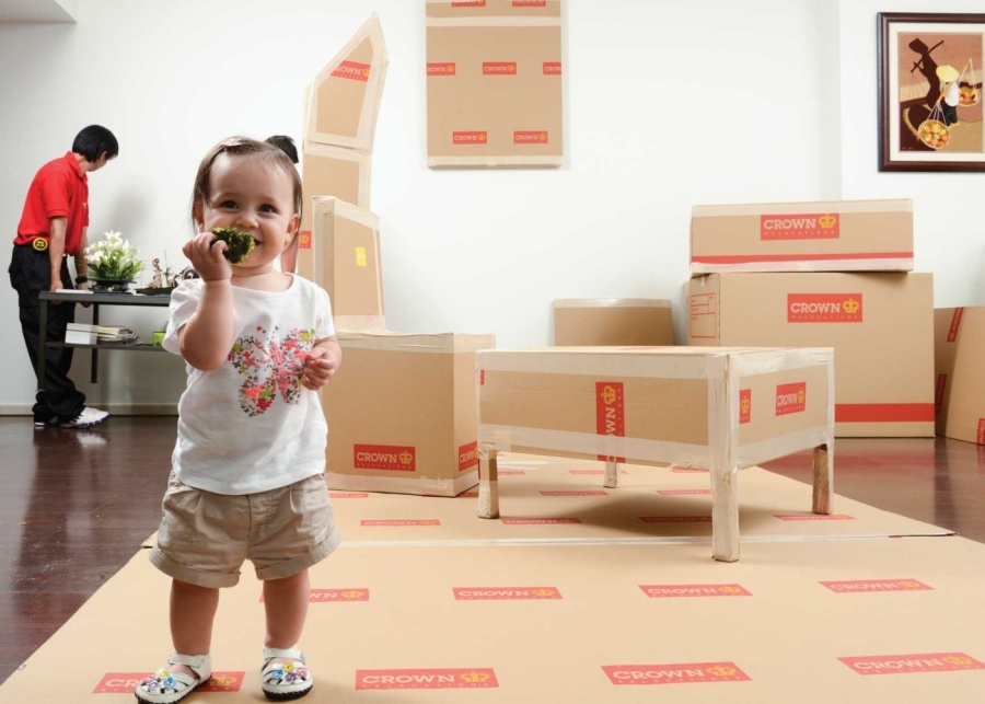 Best international movers in Singapore - Baby standing while move is in progress