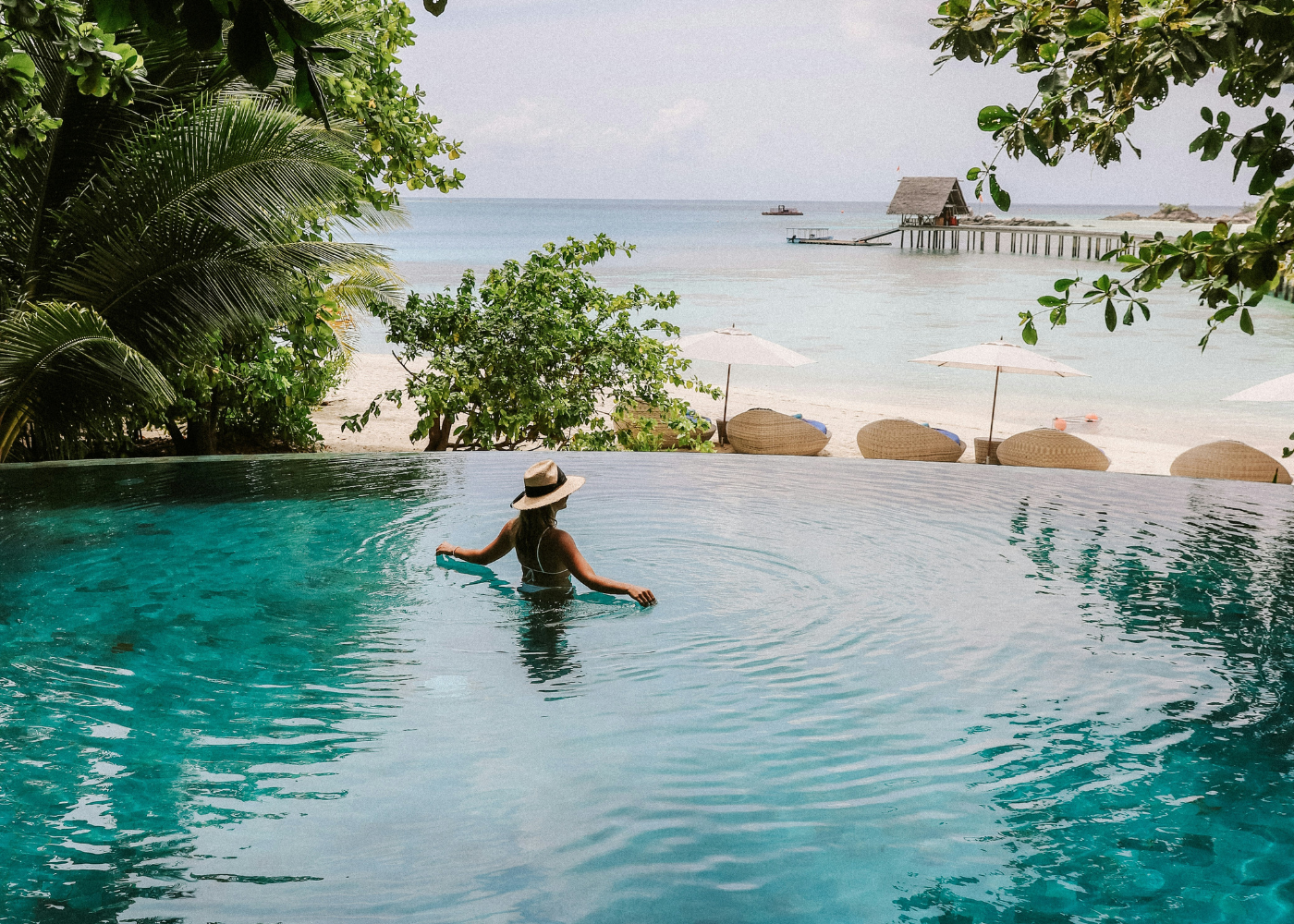 woman in swimming pool at bali resort