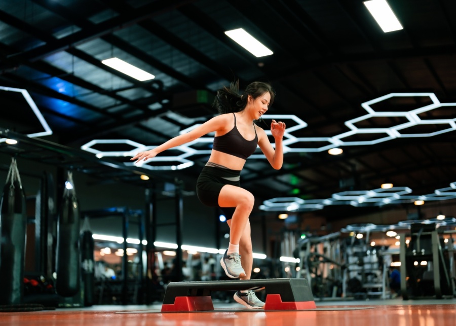 Lunch break activities - Woman doing a cardio workout in the gym