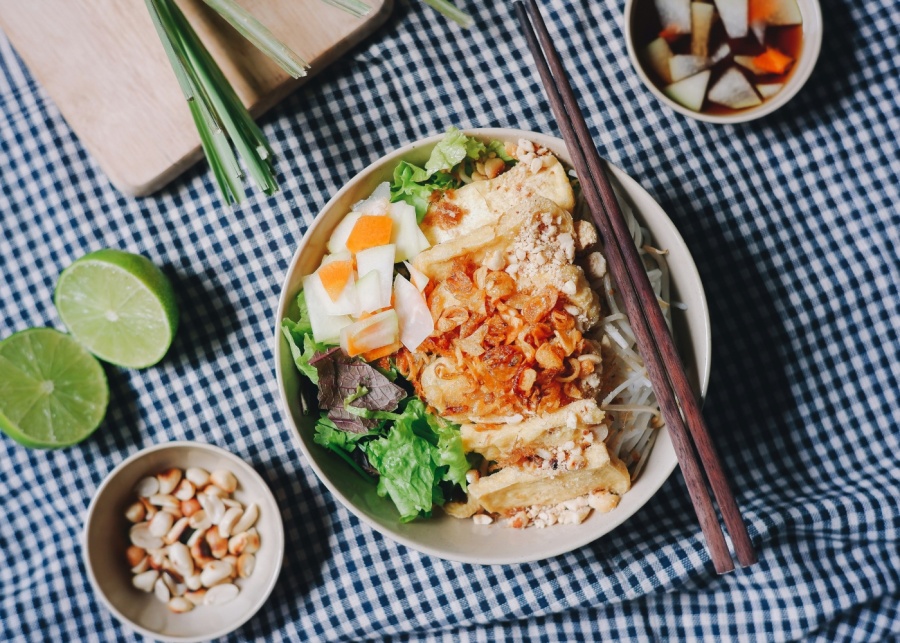 Adulting in Singapore - Topdown view of a healthy salad bowl with kimchi, egg and vegetables