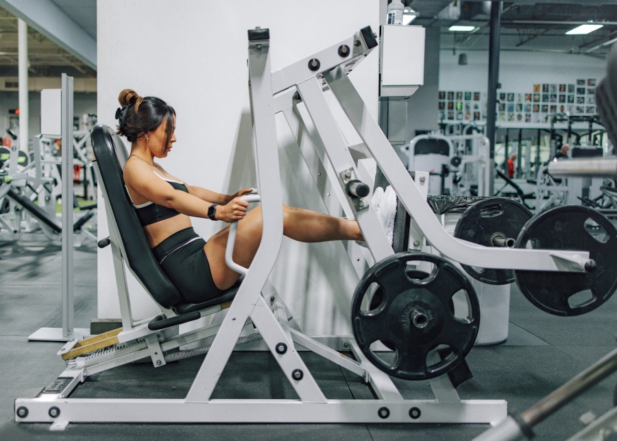 Adulting in Singapore - Woman using legpress machine in gym