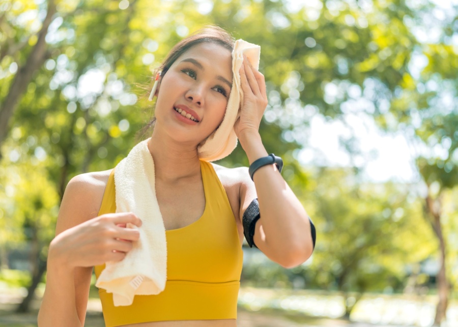 Eczema - Active asian female exercising outdoors