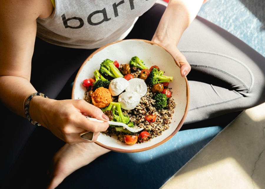 Eczema - Topdown view of woman eating a healthy salad bowl