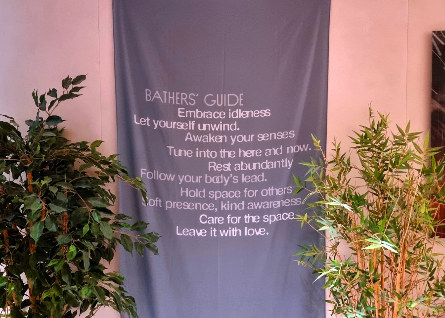 Bathers' guide at Nowhere Baths' bathroom area