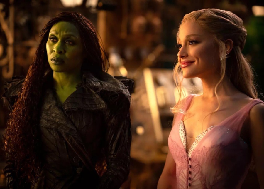 Glinda and Elphaba looking at someone in Wicked: For Good still | Ariana Grande and Cynthia Erivo in Singapore for Wicked: For Good premiere