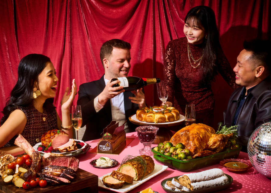 Best Christmas food delivery in Singapore - Grand Hyatt Singapore - Group of friends gathering with a festive spread