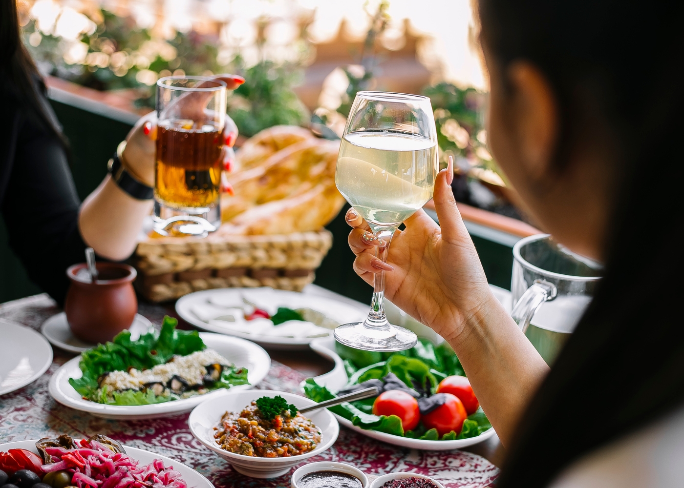 Best champagne brunches in Singapore - Close-up of a couple toasting over brunch