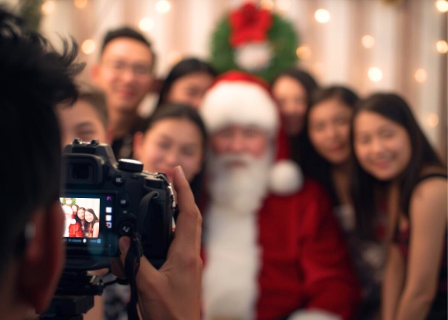Far East Flora Christmas 2025 - A group of people taking a photo with Santa Claus
