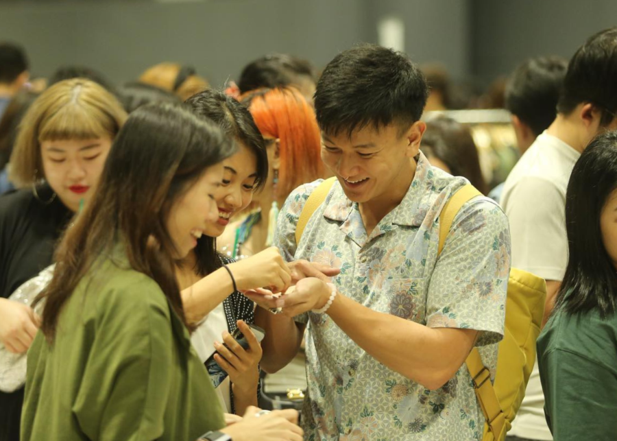 Smiley shoppers at booth | Public Garden market at Suntec Singapore