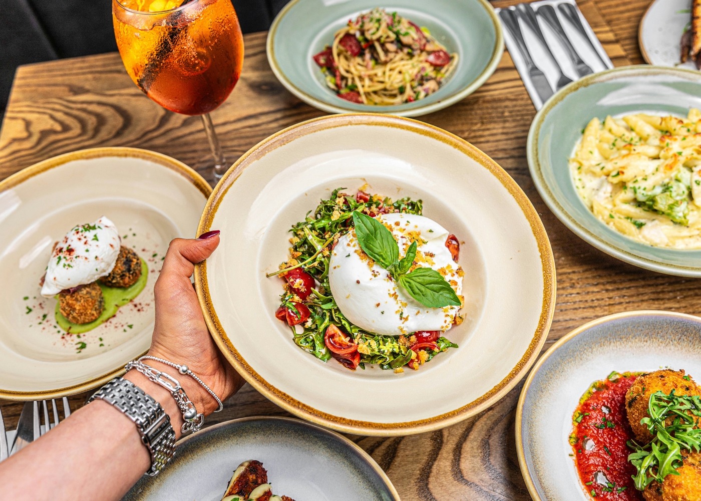 Best Italian restaurants in Singapore - A spread of Italian dishes including burrata and pasta