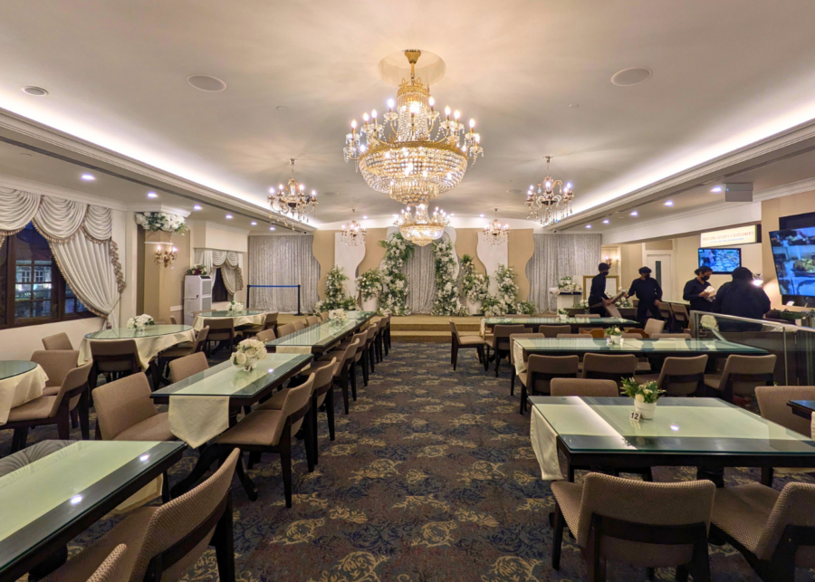 Restaurant interior with a dais and modern chandeliers | The Buffet Club Singapore
