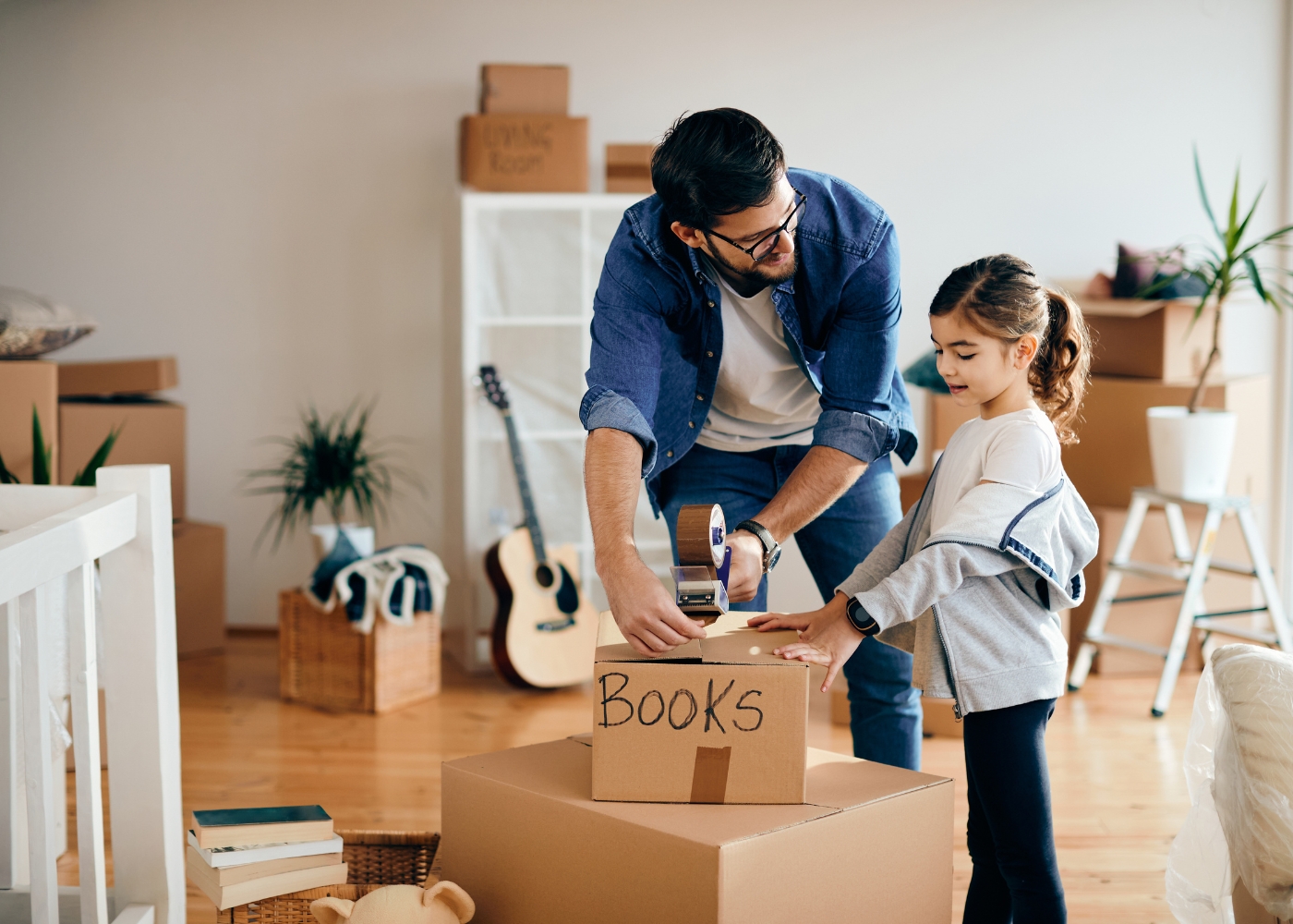 Best international movers in Singapore - A father and daughter unpacking in their new house
