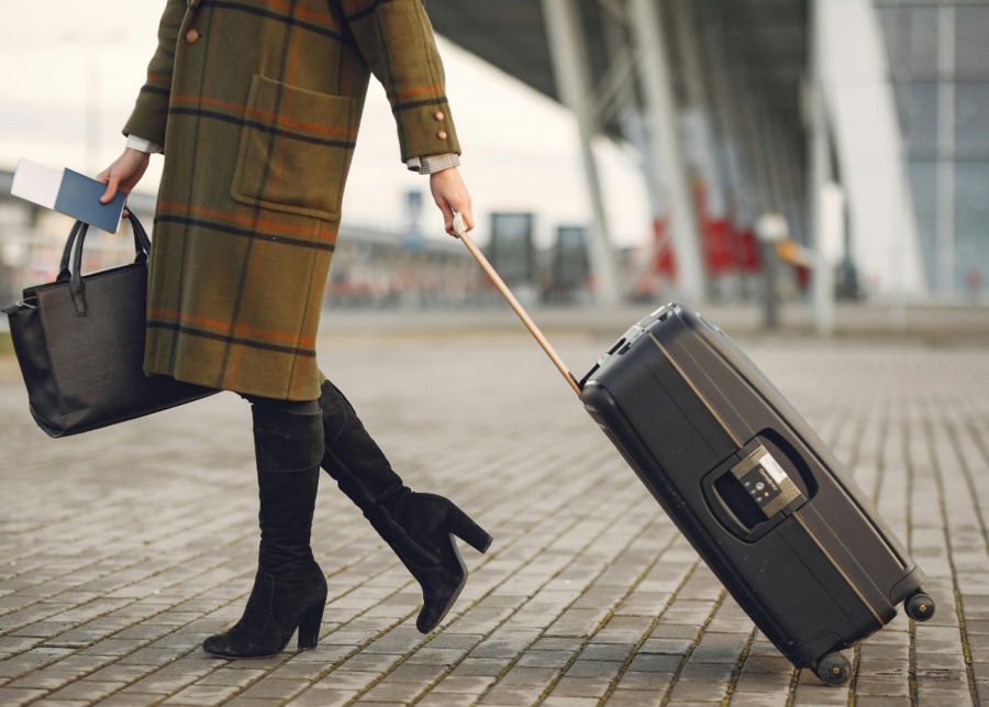 Self-care gifts - Close-up of a woman dragging her luggage