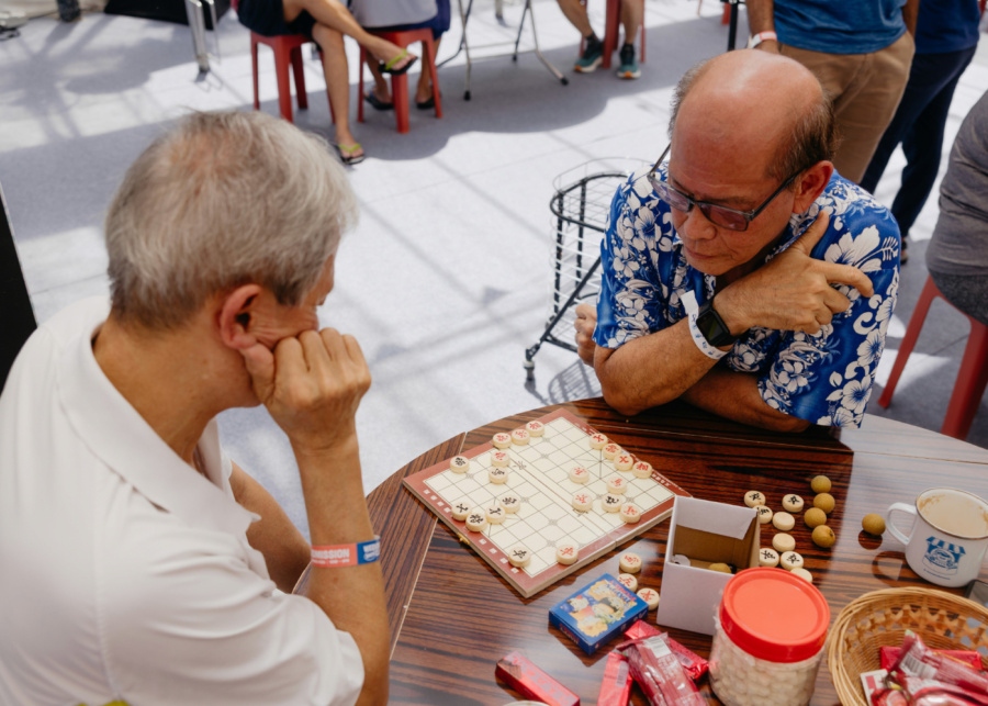 Two players in deep concentration Chinese chess game | Weekend Brew Club in Singapore