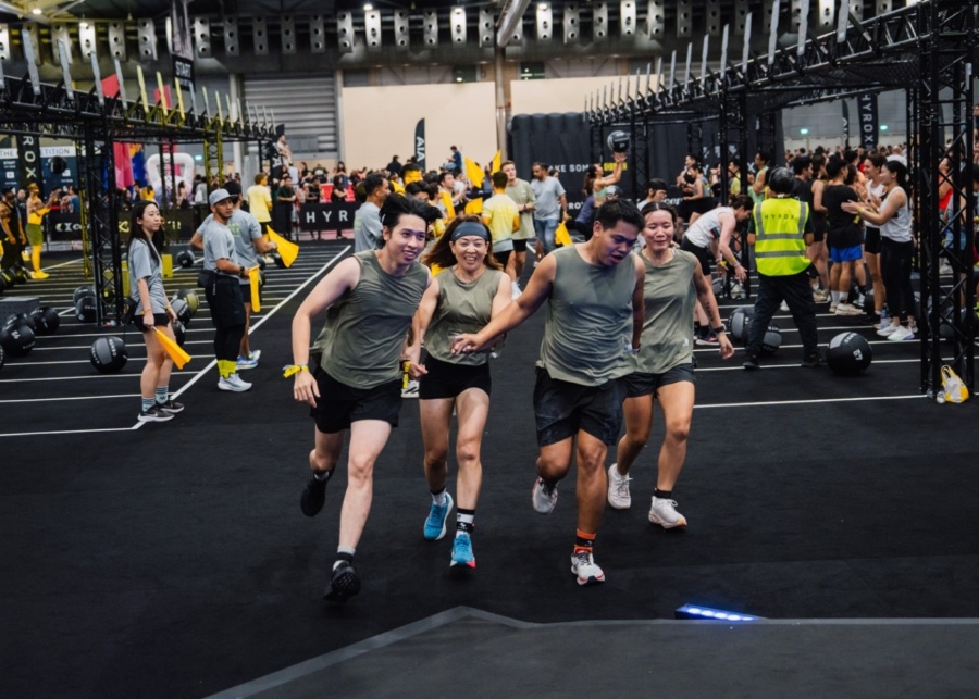 Hyrox events in Singapore and Asia-Pacific 2026 - Relay race participants running to the finish line