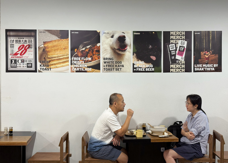 Two people chatting at Peh Gao Coffeeshop