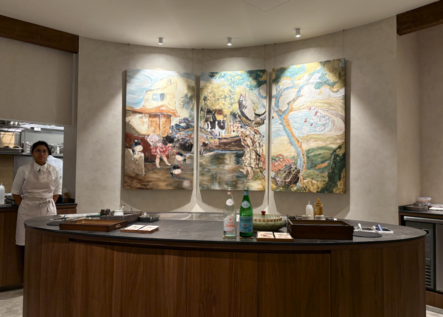 Counter seating with a view of the chefs and artwork | Asin restaurant in Singapore chef Ace Tan