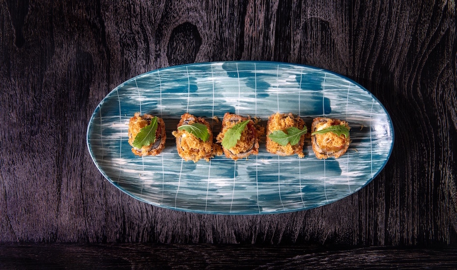 Dine beside the Seminyak seaside at SugarSand for fine Japanese-inspired food, sunset views & cool tunes