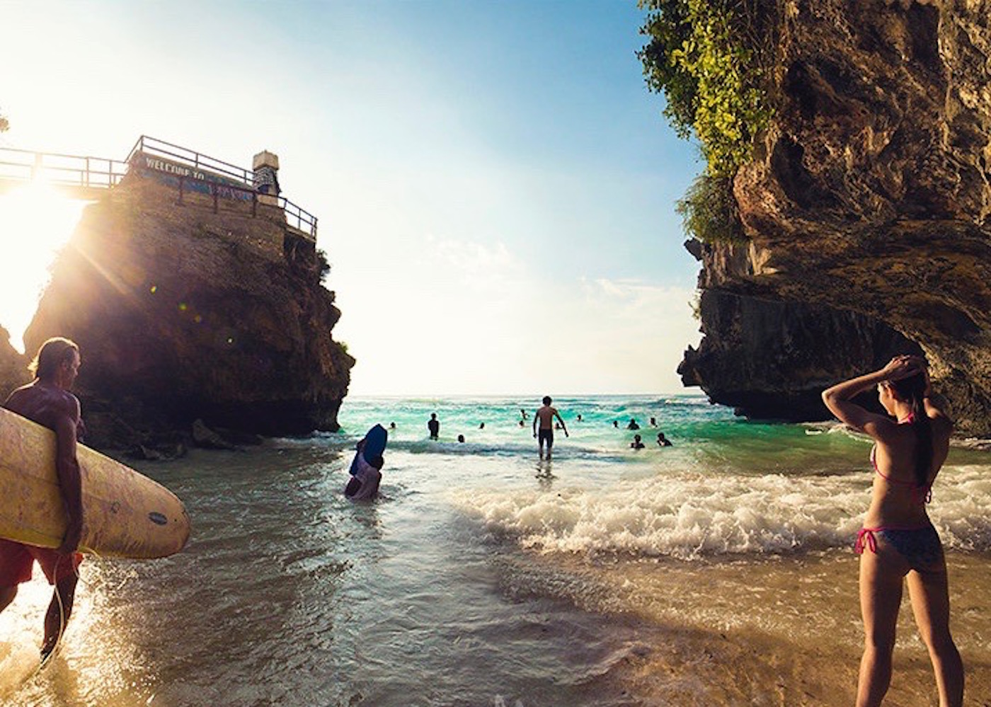 Surfers and beachgoers at Suluban in Uluwatu - one of Bali's best beaches