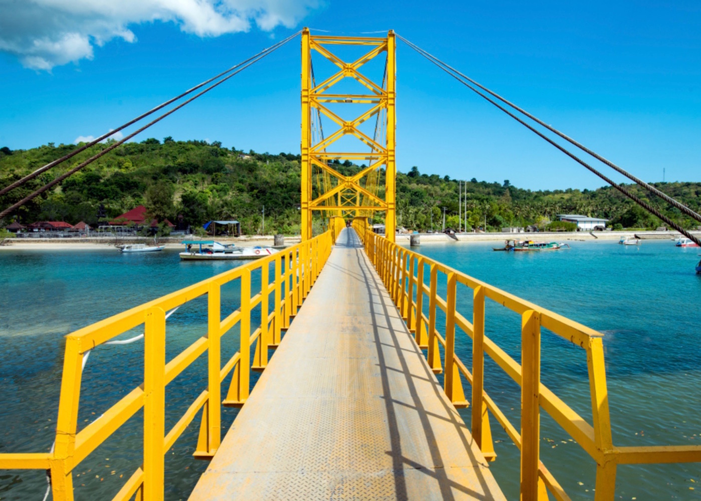 Yellow Suspension Bridge connecting Nusa Lembongan to Nusa Ceningan in Indonesia