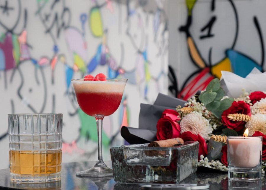 cocktails and cigars with graffiti arts as the backdrop at L'Atelier by Cyril Kongo, The Apurva Kempinski Bali, Nusa Dua