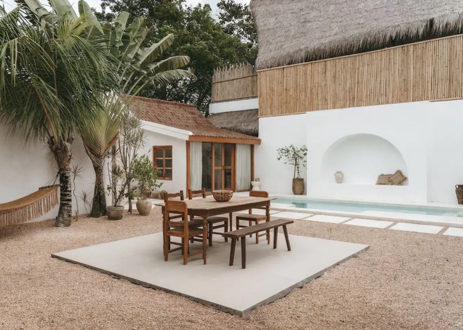 The outdoor dining space by the swimming pool at Casa Sula Villa in Uluwatu Bali Indonesia