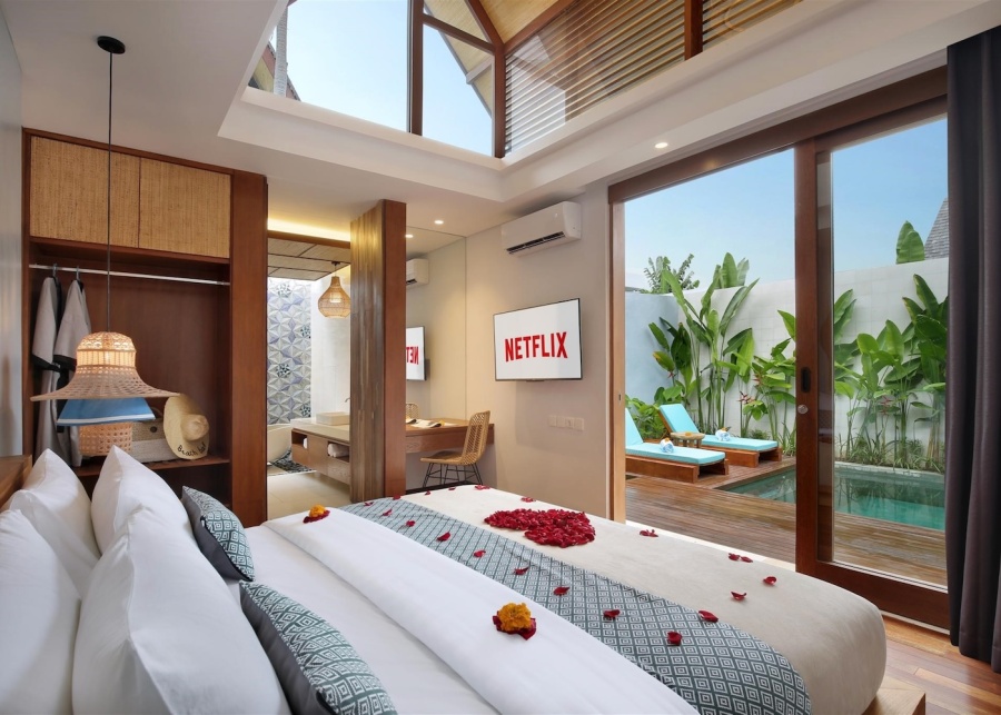 The bedroom with honeymoon decoration, air-conditioning, netflix-installed smart TV at Sanora Villas in Sanur, Bali, Indonesia