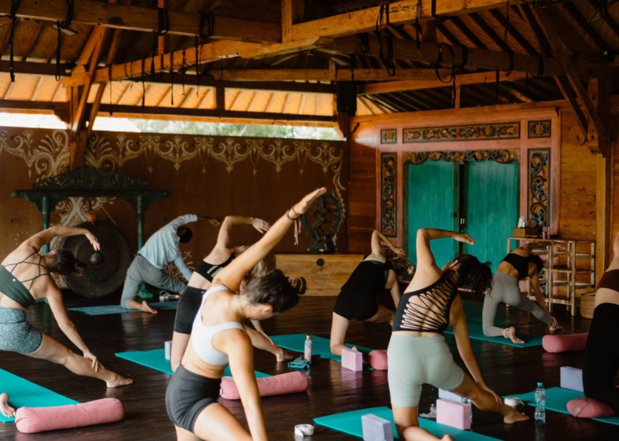 Yoga class at Yoga Searcher Bali takes place in a recycled wood joglo studio in Uluwatu