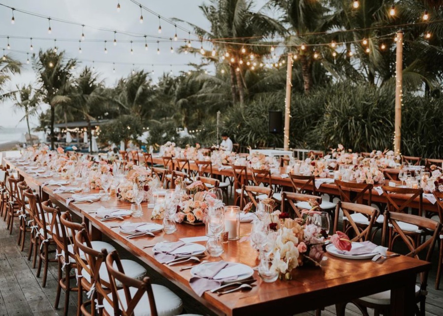 The lighting and dining table setting for a wedding reception by Bali Event Hire - one of the best vendors for events in Bali Indonesia