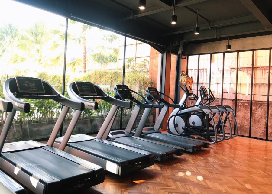 Treadmills by the window at the gym at Soham Wellness Center in Seminyak, Bali, Indonesia