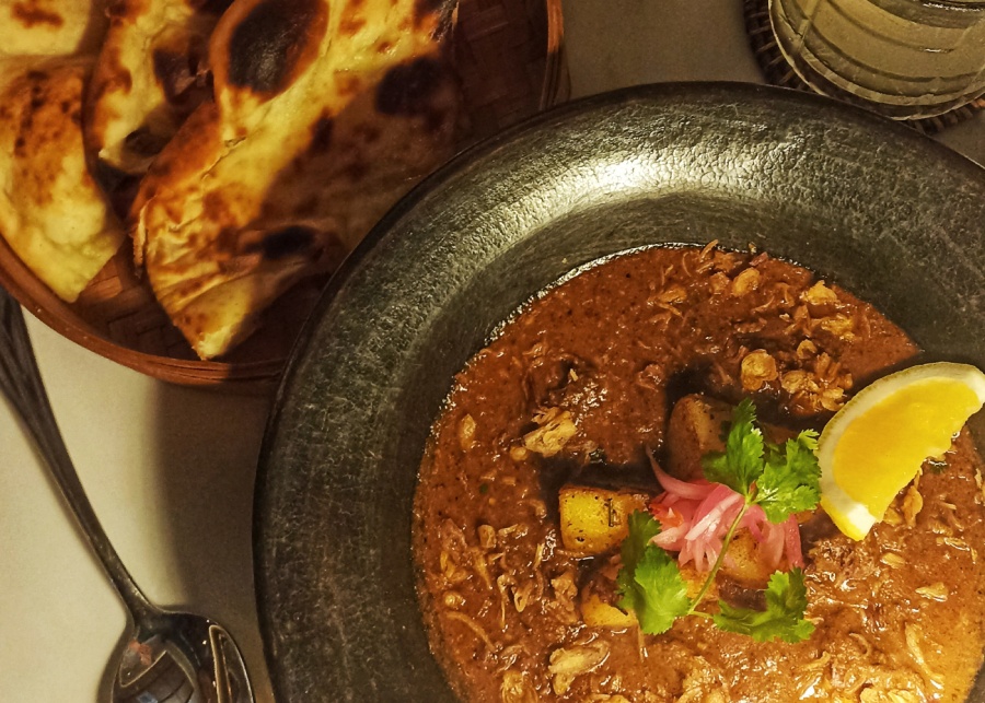 Beef curry and naan bread at Curry Traders Indian restaurant in Sanur, Bali, Indonesia