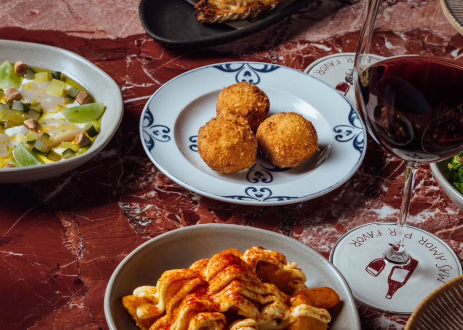 Food at Sazon restaurant in Canggu, Bali, Indonesia - featuring Squid Ink Paella and Jamon Croquetas