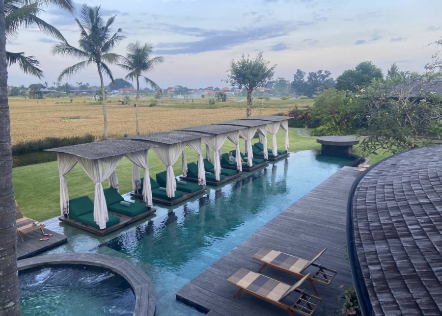 Pool and cabanas with rice paddy views at GDAS Health and wellness resort in Ubud, Bali, Indonesia