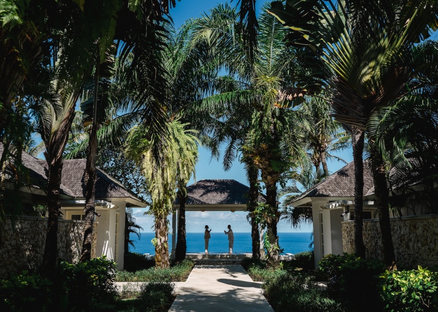 View of a temple and ocean at The Ungasan luxury clifftop resort in Uluwatu, Bali, Indonesia