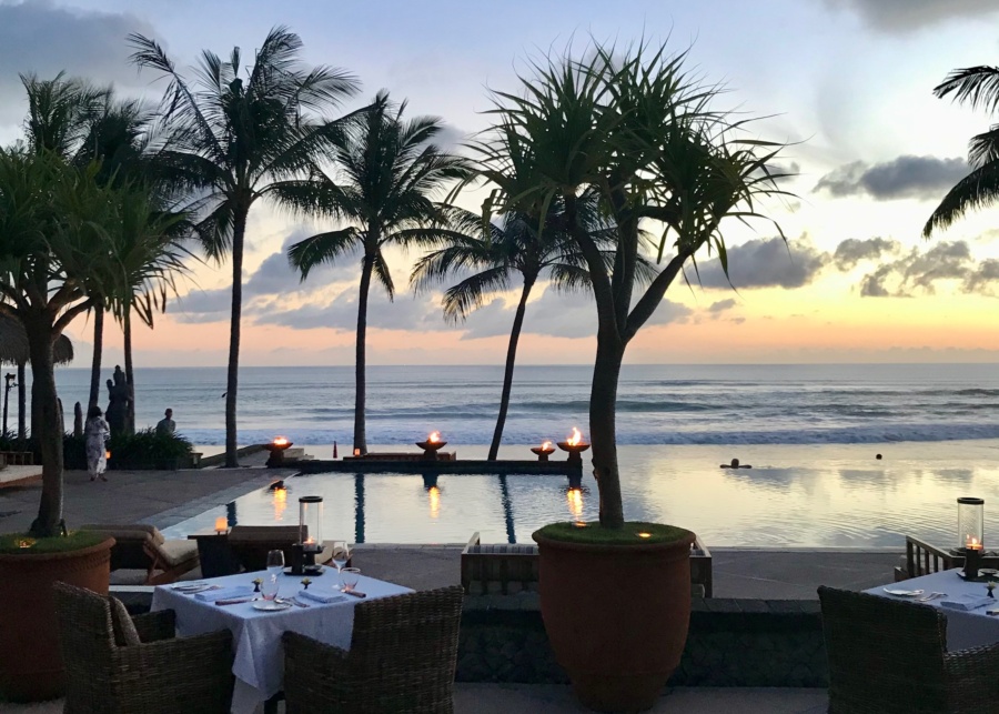 Sunset beach views at The Restaurant fine dining restaurant, located at The Legian hotel in Seminyak Bali Indonesia