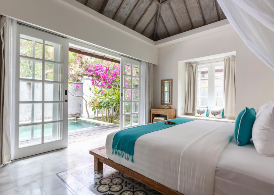 Bedroom with white accents and a private pool, at Kardia Resort, a Pramana Experience - a hotel in Gili trawangan, Lombok, Indonesia