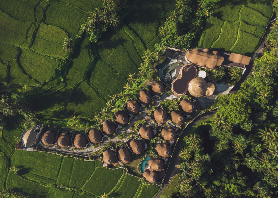Aerial view of Equipoise Resort Ubud surrounded by lush green rice terraces