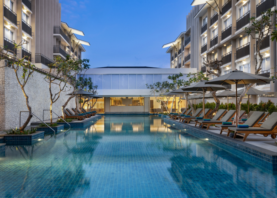 A serene evening view of the Hilton Garden Inn Nusa Dua pool area